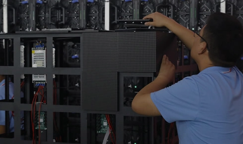 Rear view of a high-definition P3 outdoor LED video wall installation, showing internal power supplies and modules designed for 100,000-hour lifespan in 2026